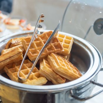 vertical-closeup-shot-small-waffles-metal-cooker-event-table